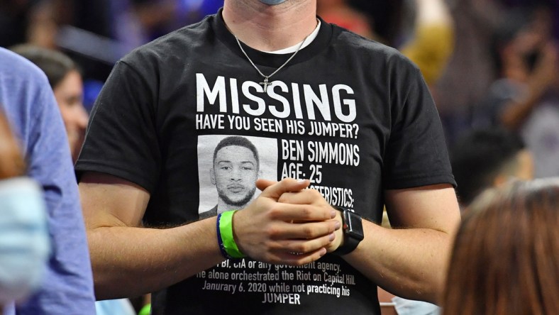 Oct 7, 2021; Philadelphia, Pennsylvania, USA;  Philadelphia 76ers fan wears a t-shirt referencing guard Ben Simmons who has not reported to training camp during the second quarter against the Toronto Raptors at Wells Fargo Center. Mandatory Credit: Eric Hartline-USA TODAY Sports