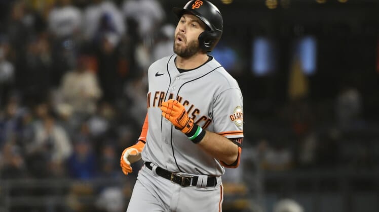 Oct 11, 2021; Los Angeles, California, USA; San Francisco Giants third baseman Evan Longoria (10) celebrates after hitting a solo home run against the Los Angeles Dodgers in the fifth inning during game three of the 2021 NLDS at Dodger Stadium. Mandatory Credit: Richard Mackson-USA TODAY Sports