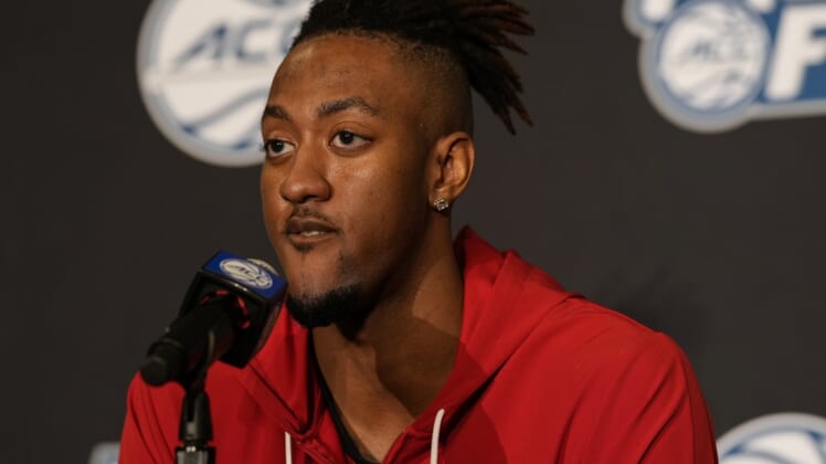Oct 12, 2021; Charlotte, NC, USA; North Carolina State Wolfpack forward Manny Bates (15) speaks to the media at the ACC Tip Off at Charlotte Marriott City Center. Mandatory Credit: Jim Dedmon-USA TODAY Sports