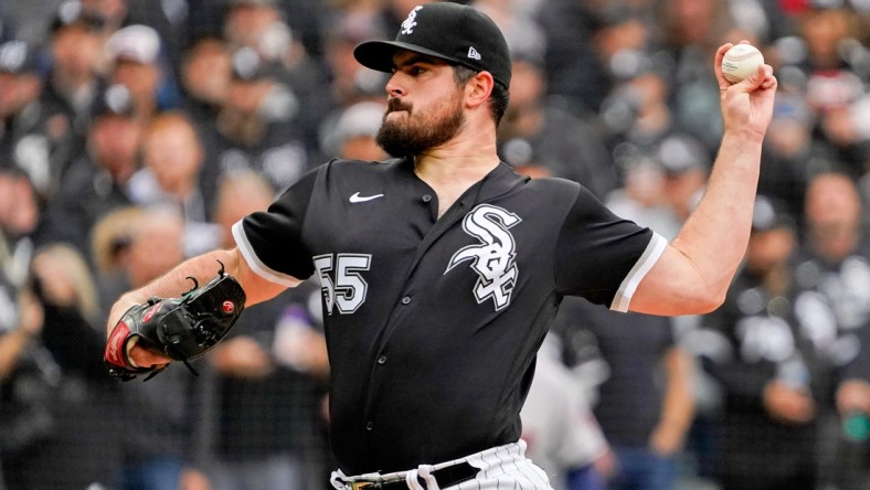 Oct 12, 2021; Chicago, Illinois, USA; Chicago White Sox starting pitcher Carlos Rodon (55) pitches against the Houston Astros during the first inning in game four of the 2021 ALDS at Guaranteed Rate Field. Mandatory Credit: David Banks-USA TODAY Sports