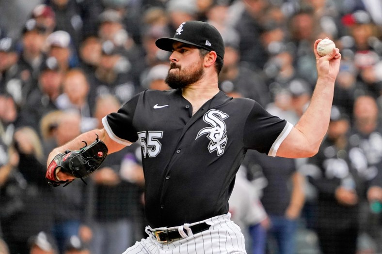 Oct 12, 2021; Chicago, Illinois, USA; Chicago White Sox starting pitcher Carlos Rodon (55) pitches against the Houston Astros during the first inning in game four of the 2021 ALDS at Guaranteed Rate Field. Mandatory Credit: David Banks-USA TODAY Sports