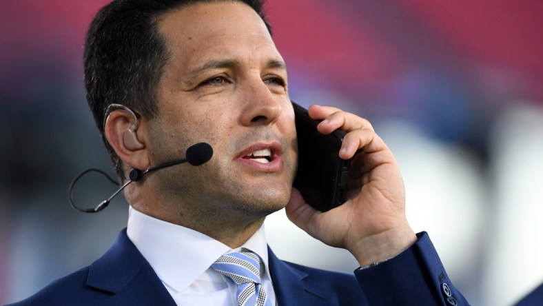 Oct 18, 2021; Nashville, Tennessee, USA; ESPN NFL Insider Adam Schefter talks on his phone before the Monday Night Football game between the Tennessee Titans and the Buffalo Bills at Nissan Stadium. Mandatory Credit: Christopher Hanewinckel-USA TODAY Sports