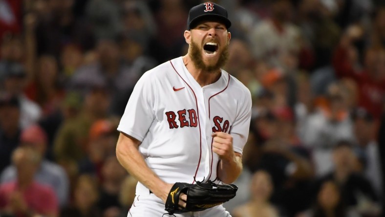 Oct 20, 2021; Boston, Massachusetts, USA; Boston Red Sox starting pitcher Chris Sale (41) reacts after throwing a strikeout for the third out against the Houston Astros in the fourth inning of game five of the 2021 ALCS at Fenway Park. Mandatory Credit: Bob DeChiara-USA TODAY Sports