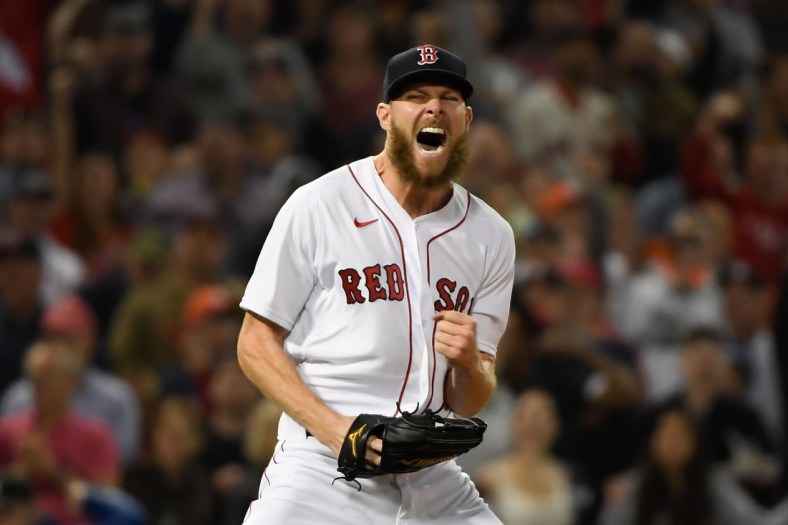 Oct 20, 2021; Boston, Massachusetts, USA; Boston Red Sox starting pitcher Chris Sale (41) reacts after throwing a strikeout for the third out against the Houston Astros in the fourth inning of game five of the 2021 ALCS at Fenway Park. Mandatory Credit: Bob DeChiara-USA TODAY Sports