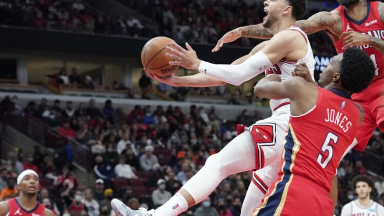 Oct 22, 2021; Chicago, Illinois, USA; Chicago Bulls guard Zach LaVine (8) is defended by New Orleans Pelicans forward Herbert Jones (5) during the second half at United Center. Mandatory Credit: David Banks-USA TODAY Sports