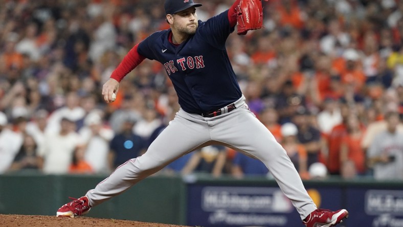 Oct 22, 2021; Houston, Texas, USA; Boston Red Sox relief pitcher Adam Ottavino (0) throws the ball in the eighth inning against the Houston Astros during game six of the 2021 ALCS at Minute Maid Park. Mandatory Credit: Thomas Shea-USA TODAY Sports