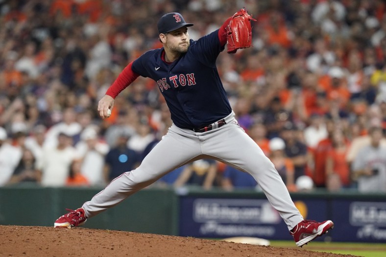 Oct 22, 2021; Houston, Texas, USA; Boston Red Sox relief pitcher Adam Ottavino (0) throws the ball in the eighth inning against the Houston Astros during game six of the 2021 ALCS at Minute Maid Park. Mandatory Credit: Thomas Shea-USA TODAY Sports