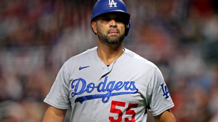 Oct 23, 2021; Cumberland, Georgia, USA; Los Angeles Dodgers first baseman Albert Pujols (55) reacts during the fourth inning against the Atlanta Braves in game six of the 2021 NLCS at Truist Park. Mandatory Credit: Brett Davis-USA TODAY Sports