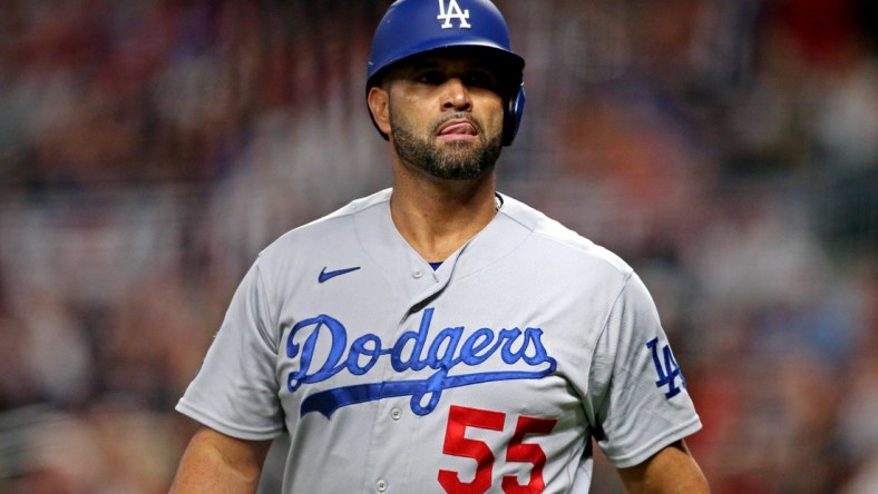 Oct 23, 2021; Cumberland, Georgia, USA; Los Angeles Dodgers first baseman Albert Pujols (55) reacts during the fourth inning against the Atlanta Braves in game six of the 2021 NLCS at Truist Park. Mandatory Credit: Brett Davis-USA TODAY Sports