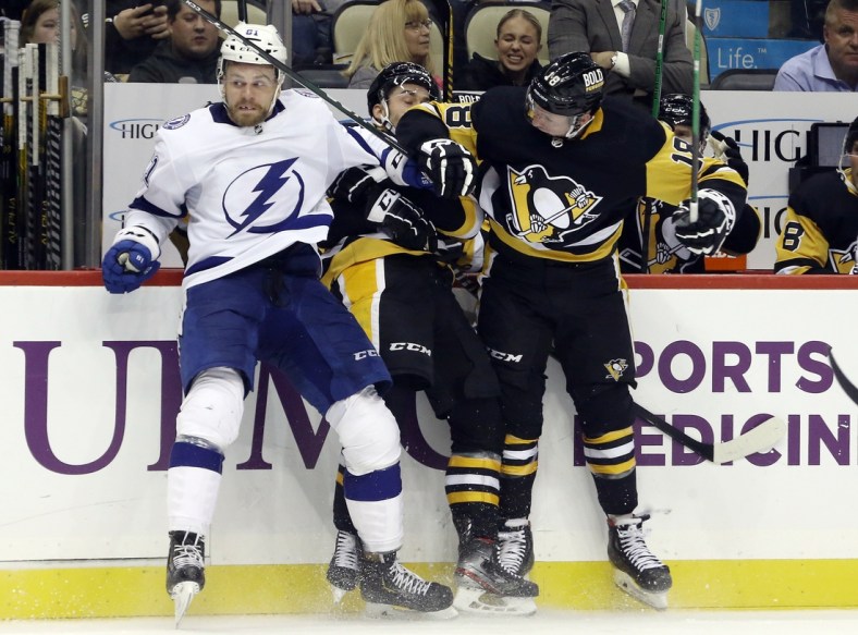 Oct 26, 2021; Pittsburgh, Pennsylvania, USA;  Tampa Bay Lightning defenseman Erik Cernak (81) collides with Pittsburgh Penguins center Teddy Blueger (53) and center Sam Lafferty (18) during the third period at PPG Paints Arena. Tampa Bay won 5-1. Mandatory Credit: Charles LeClaire-USA TODAY Sports