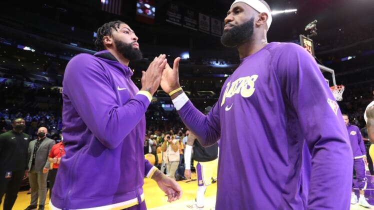Oct 19, 2021; Los Angeles, California, USA; Los Angeles Lakers forward Anthony Davis (3) and forward LeBron James (6)  hi-five prior to the game against the Golden State Warriors at Staples Center. The Warriors won 121-114. Mandatory Credit: Kiyoshi Mio-USA TODAY Sports