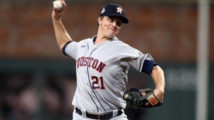 Oct 30, 2021; Atlanta, Georgia, USA; Houston Astros starting pitcher Zack Greinke (21) throws against the Atlanta Braves during the first inning of game four of the 2021 World Series at Truist Park. Mandatory Credit: Brett Davis-USA TODAY Sports