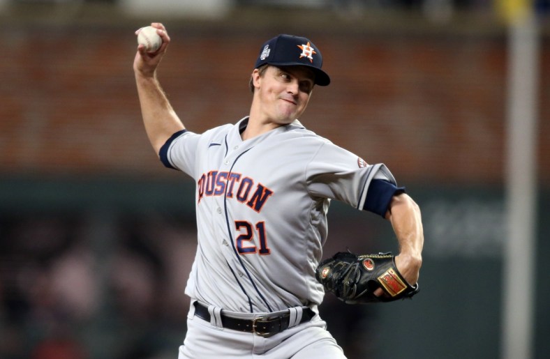 Oct 30, 2021; Atlanta, Georgia, USA; Houston Astros starting pitcher Zack Greinke (21) throws against the Atlanta Braves during the first inning of game four of the 2021 World Series at Truist Park. Mandatory Credit: Brett Davis-USA TODAY Sports
