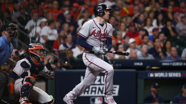 Nov 2, 2021; Houston, TX, USA; Atlanta Braves first baseman Freddie Freeman (5) hits a solo home run against the Houston Astros during the seventh inning in game six of the 2021 World Series at Minute Maid Park. Mandatory Credit: Troy Taormina-USA TODAY Sports
