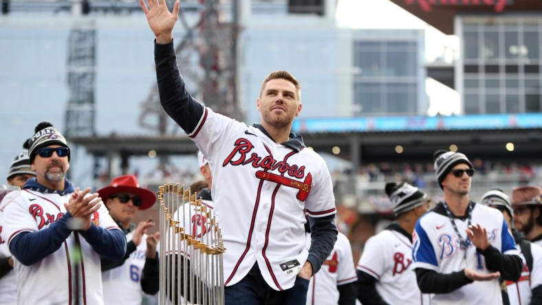 Nov 5, 2021; Atlanta, GA, USA; Atlanta Braves first baseman Freddie Freeman waves to the crowd during the World Series championship rally at Truist Park. Mandatory Credit: Brett Davis-USA TODAY Sports