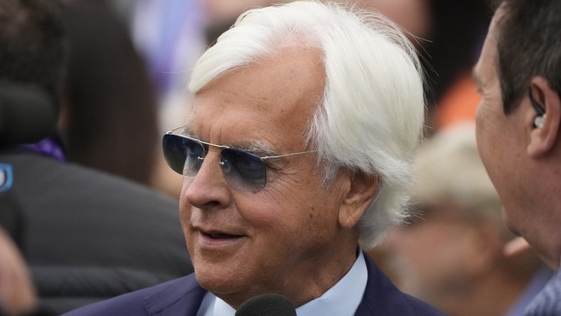 Nov 5, 2021; Del Mar, CA, USA;  Bob Baffert, trainer of Corniche, celebrates his win in the Breeders    Cup Juvenile race during the Breeders    Cup World Championships at Del Mar Race track. Mandatory Credit: Ray Acevedo-USA TODAY Sports