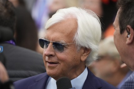 Nov 5, 2021; Del Mar, CA, USA;  Bob Baffert, trainer of Corniche, celebrates his win in the Breeders    Cup Juvenile race during the Breeders    Cup World Championships at Del Mar Race track. Mandatory Credit: Ray Acevedo-USA TODAY Sports