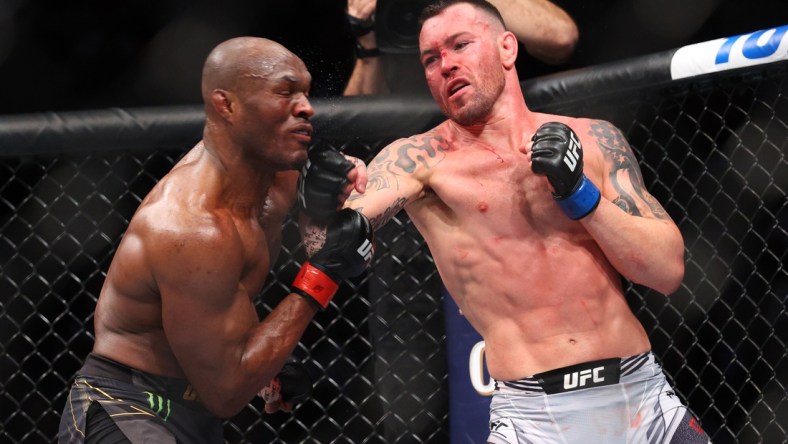 Nov 6, 2021; New York, NY, USA; Kamaru Usman (red gloves) competes against Colby Covington (blue gloves) during UFC 268 at Madison Square Garden. Mandatory Credit: Ed Mulholland-USA TODAY Sports