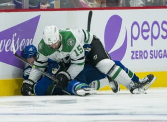 Nov 7, 2021; Vancouver, British Columbia, CAN; Dallas Stars forward Blake Comeau (15) checks Vancouver Canucks forward Elias Pettersson (40) in the second period at Rogers Arena. Mandatory Credit: Bob Frid-USA TODAY Sports