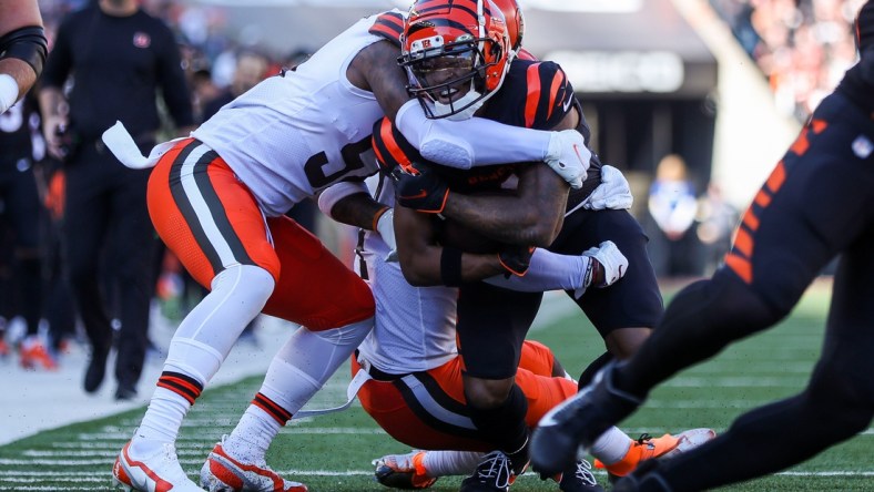 Nov 7, 2021; Cincinnati, Ohio, USA; Cleveland Browns linebacker Mack Wilson (51) tackles Cincinnati Bengals wide receiver Ja'Marr Chase (1) in the first half at Paul Brown Stadium. Mandatory Credit: Katie Stratman-USA TODAY Sports