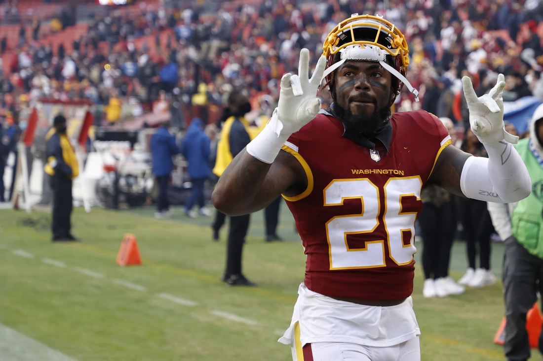 Nov 14, 2021; Landover, Maryland, USA; Washington Football Team safety Landon Collins (26) celebrates while leaving the field after the game against the Tampa Bay Buccaneers at FedExField. Mandatory Credit: Geoff Burke-USA TODAY Sports