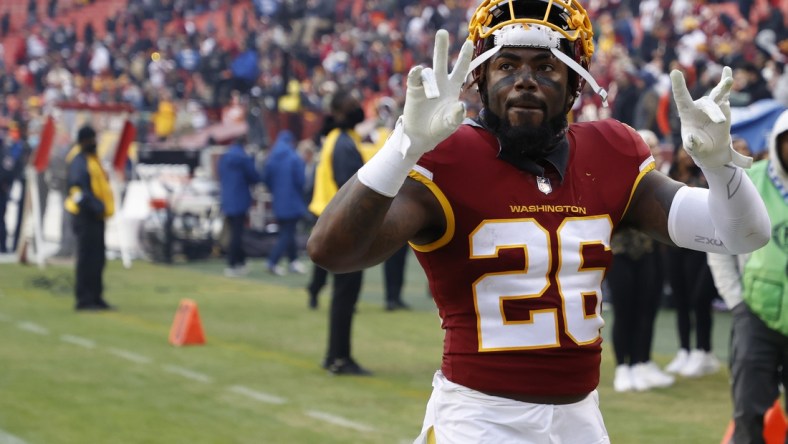 Nov 14, 2021; Landover, Maryland, USA; Washington Football Team safety Landon Collins (26) celebrates while leaving the field after the game against the Tampa Bay Buccaneers at FedExField. Mandatory Credit: Geoff Burke-USA TODAY Sports