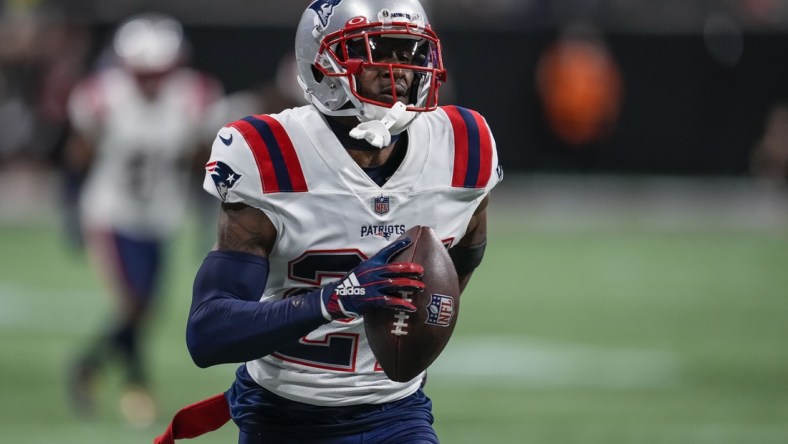 Nov 18, 2021; Atlanta, Georgia, USA; New England Patriots cornerback J.C. Jackson (27) runs after intercepting a pass against the Atlanta Falcons during the fourth quarter at Mercedes-Benz Stadium. Mandatory Credit: Dale Zanine-USA TODAY Sports