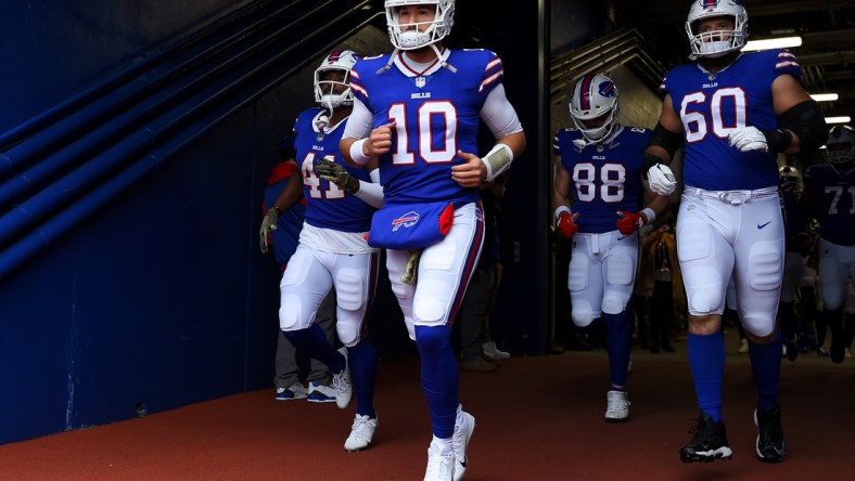 Nov 21, 2021; Orchard Park, New York, USA; Buffalo Bills quarterback Mitchell Trubisky (10) leads teammates to the field prior to the game against the Indianapolis Colts at Highmark Stadium. Mandatory Credit: Rich Barnes-USA TODAY Sports