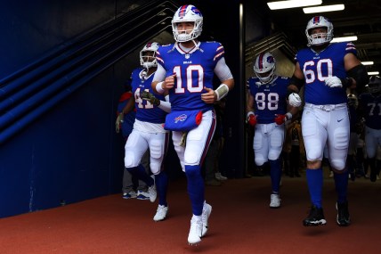 Nov 21, 2021; Orchard Park, New York, USA; Buffalo Bills quarterback Mitchell Trubisky (10) leads teammates to the field prior to the game against the Indianapolis Colts at Highmark Stadium. Mandatory Credit: Rich Barnes-USA TODAY Sports