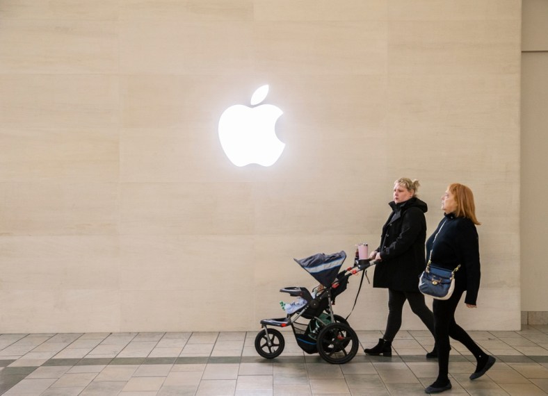 Two women walk under the Apple logo while shopping at Oxmoor Mall in Louisville, Kentucky on Black Friday. Nov 26, 2021

Aj4t9207