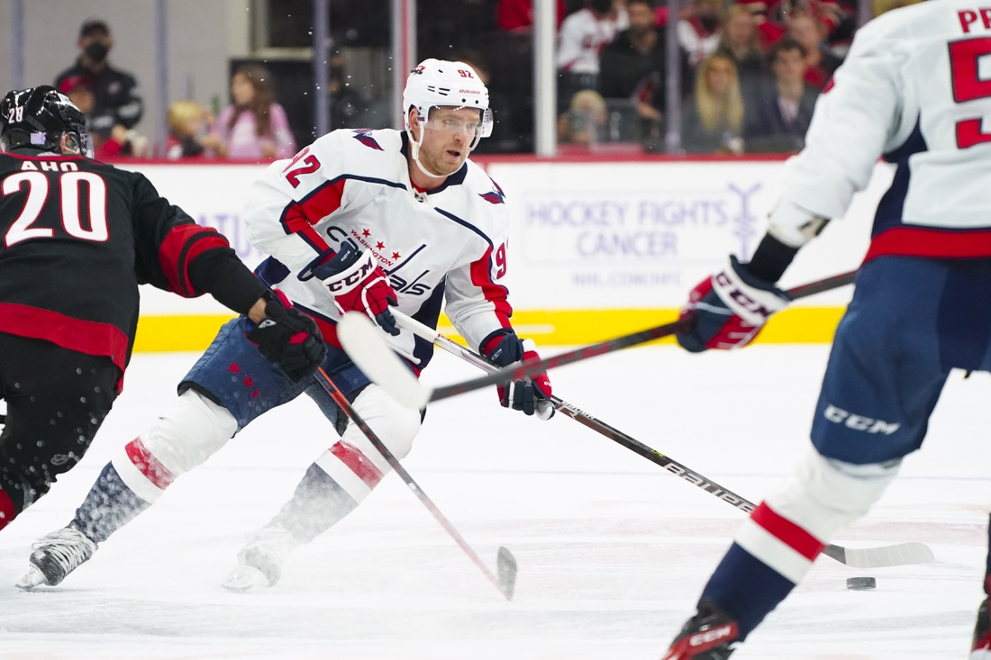 Nov 28, 2021; Raleigh, North Carolina, USA;  Washington Capitals center Evgeny Kuznetsov (92) skates with the puck against the Carolina Hurricanes during the third period at PNC Arena. Mandatory Credit: James Guillory-USA TODAY Sports