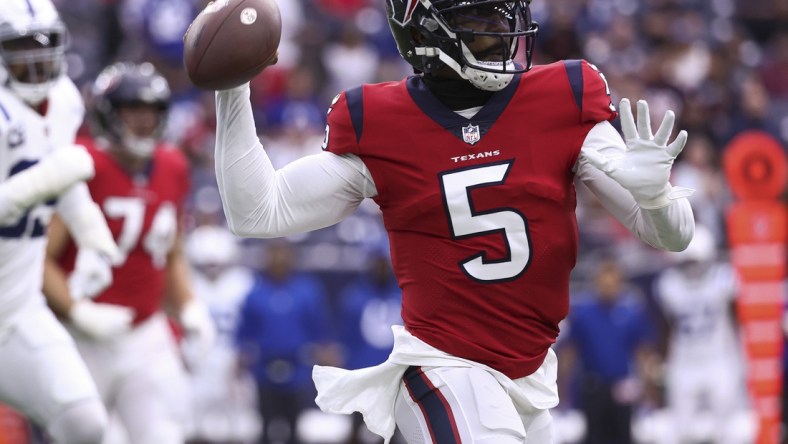 Dec 5, 2021; Houston, Texas, USA; Houston Texans quarterback Tyrod Taylor (5) attempts a pass during the first quarter against the Indianapolis Colts at NRG Stadium. Mandatory Credit: Troy Taormina-USA TODAY Sports