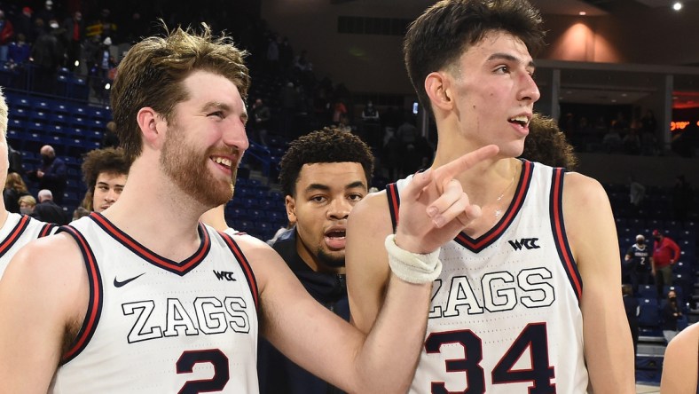 Dec 9, 2021; Spokane, Washington, USA; Gonzaga Bulldogs forward Drew Timme (2) and Gonzaga Bulldogs center Chet Holmgren (34) look at the Gonzaga student section after a game against the Merrimack Warriors
 in the second half at McCarthey Athletic Center. Gonzaga won 80-55. Mandatory Credit: James Snook-USA TODAY Sports