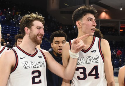Dec 9, 2021; Spokane, Washington, USA; Gonzaga Bulldogs forward Drew Timme (2) and Gonzaga Bulldogs center Chet Holmgren (34) look at the Gonzaga student section after a game against the Merrimack Warriors
 in the second half at McCarthey Athletic Center. Gonzaga won 80-55. Mandatory Credit: James Snook-USA TODAY Sports