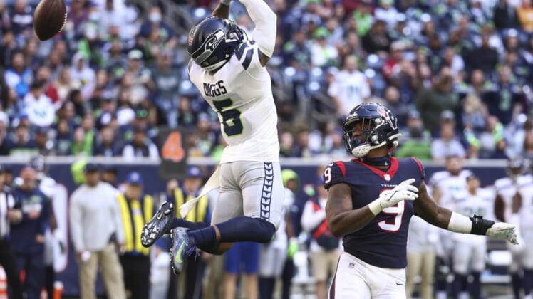 Dec 12, 2021; Houston, Texas, USA; Seattle Seahawks free safety Quandre Diggs (6) attempts to intercept a pass intended for Houston Texans tight end Brevin Jordan (9) during the fourth quarter at NRG Stadium. Mandatory Credit: Troy Taormina-USA TODAY Sports