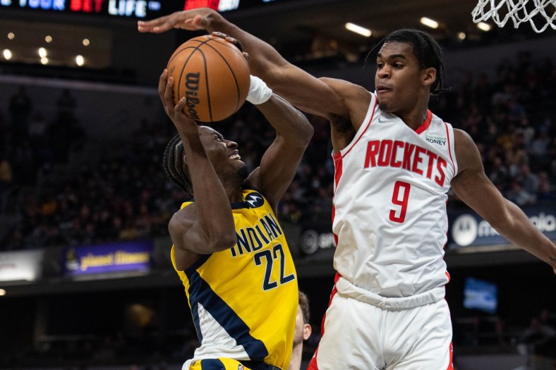 Dec 23, 2021; Indianapolis, Indiana, USA; Indiana Pacers guard Caris LeVert (22) shoots the ball while Houston Rockets guard Josh Christopher (9) defends in the second half at Gainbridge Fieldhouse. Mandatory Credit: Trevor Ruszkowski-USA TODAY Sports
