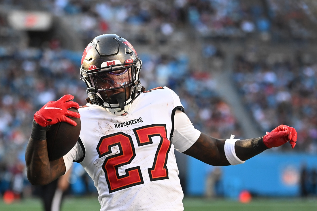 Dec 26, 2021; Charlotte, North Carolina, USA;  Tampa Bay Buccaneers running back Ronald Jones (27) scores a touchdown in the third quarter at Bank of America Stadium. Mandatory Credit: Bob Donnan-USA TODAY Sports