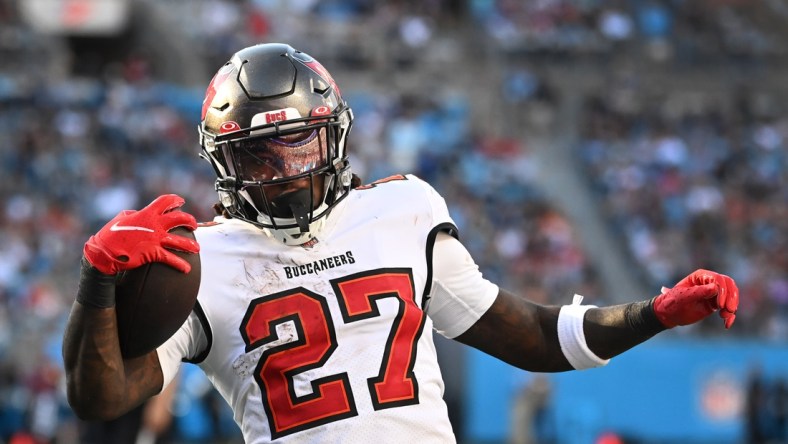 Dec 26, 2021; Charlotte, North Carolina, USA;  Tampa Bay Buccaneers running back Ronald Jones (27) scores a touchdown in the third quarter at Bank of America Stadium. Mandatory Credit: Bob Donnan-USA TODAY Sports