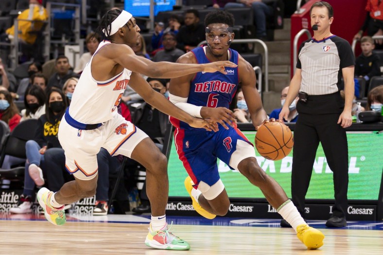 Dec 29, 2021; Detroit, Michigan, USA; Detroit Pistons guard Hamidou Diallo (6) drives to the basket against New York Knicks guard Immanuel Quickley (5) during the third quarter at Little Caesars Arena. Mandatory Credit: Raj Mehta-USA TODAY Sports
