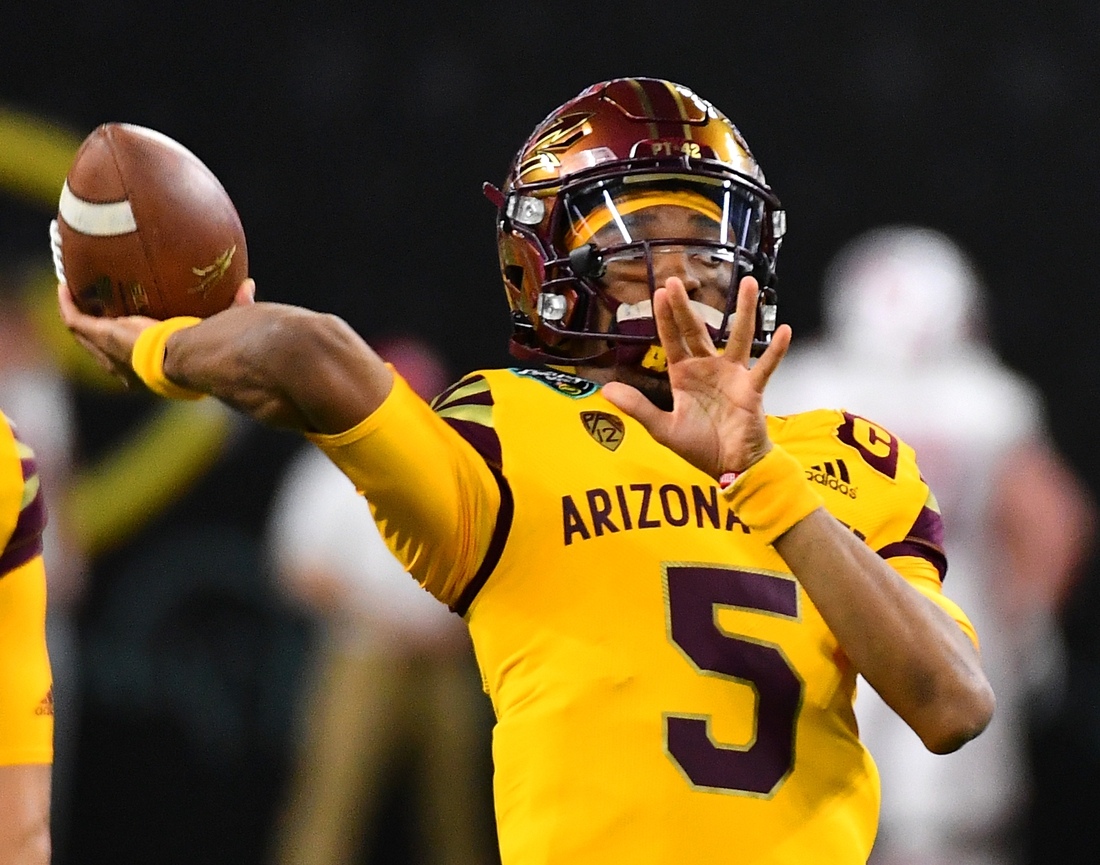 Dec 30, 2021; Paradise, Nevada, USA; Arizona State Sun Devils quarterback Jayden Daniels (5) warms up before facing the Wisconsin Badgers in the 2021 Las Vegas Bowl at Allegiant Stadium. Mandatory Credit: Stephen R. Sylvanie-USA TODAY Sports