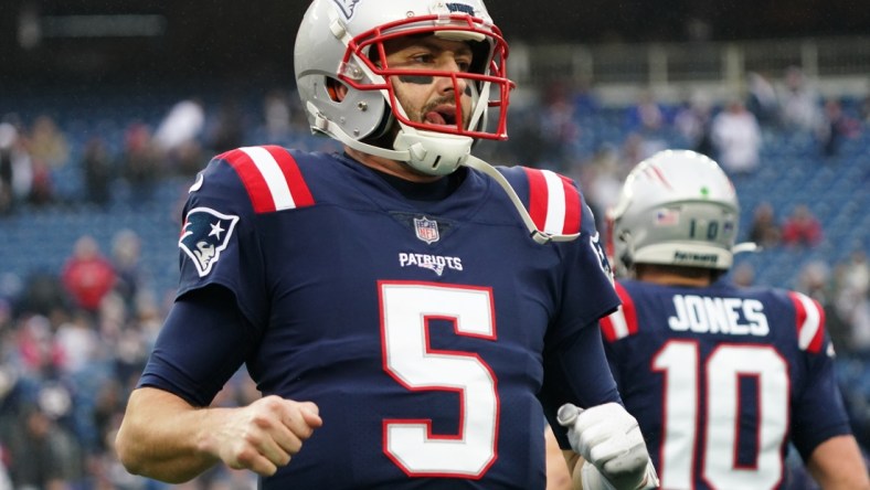 Jan 2, 2022; Foxborough, Massachusetts, USA; New England Patriots quarterback Brian Hoyer (5) warms up before the start of a game against the Jacksonville Jaguars at Gillette Stadium. Mandatory Credit: David Butler II-USA TODAY Sports
