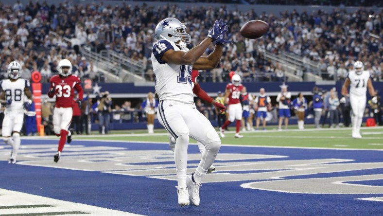 Jan 2, 2022; Arlington, Texas, USA; Dallas Cowboys wide receiver Amari Cooper (19) catches a touchdown pass in the fourth quarter against the Arizona Cardinals at AT&T Stadium. Mandatory Credit: Tim Heitman-USA TODAY Sports