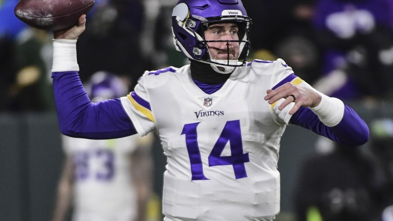 Jan 2, 2022; Green Bay, Wisconsin, USA; Minnesota Vikings quarterback Sean Mannion (14) warms up before game against the Green Bay Packers at Lambeau Field. Mandatory Credit: Benny Sieu-USA TODAY Sports