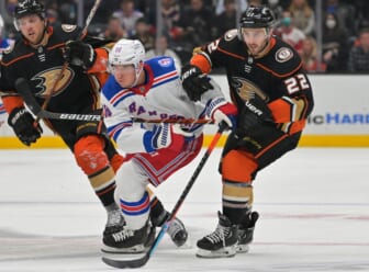 Jan 8, 2022; Anaheim, California, USA; New York Rangers center Ryan Strome (16) and Anaheim Ducks defenseman Kevin Shattenkirk (22) chase down the puck in the second period at Honda Center. Mandatory Credit: Jayne Kamin-Oncea-USA TODAY Sports