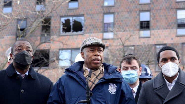Jan 10, 2022; Bronx, New York, USA; New York City Mayor Eric Adams and other officials speak to the media at the Twin Parks North West apartment building in the Bronx Jan. 10, 2022. Seventeen people died in a fire in the building on Sunday. The fire was believed to have been caused by a defective space heater which caused heavy smoke conditions throughout the building. Mandatory Credit: Seth Harrison-USA TODAY