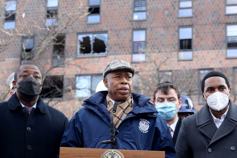 Jan 10, 2022; Bronx, New York, USA; New York City Mayor Eric Adams and other officials speak to the media at the Twin Parks North West apartment building in the Bronx Jan. 10, 2022. Seventeen people died in a fire in the building on Sunday. The fire was believed to have been caused by a defective space heater which caused heavy smoke conditions throughout the building. Mandatory Credit: Seth Harrison-USA TODAY