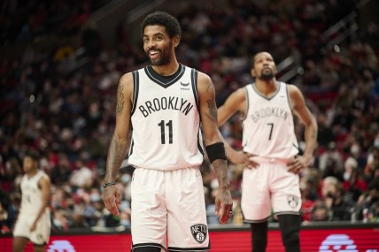 Jan 10, 2022; Portland, Oregon, USA; Brooklyn Nets guard Kyrie Irving (11) and forward Kevin Durant (7) make their way on the court after a time out during the second half against the Portland Trail Blazers at Moda Center. The Trail Blazers won the game 114-108. Mandatory Credit: Troy Wayrynen-USA TODAY Sports