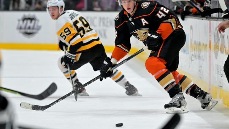Jan 11, 2022; Anaheim, California, USA; Anaheim Ducks defenseman Josh Manson (42) passes the puck in the first half of the game against the Pittsburgh Penguins at Honda Center. Mandatory Credit: Jayne Kamin-Oncea-USA TODAY Sports