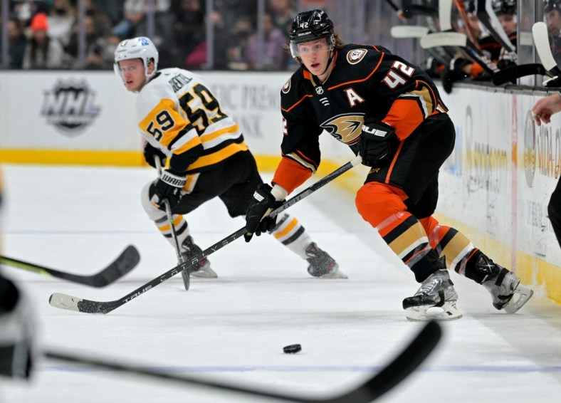 Jan 11, 2022; Anaheim, California, USA; Anaheim Ducks defenseman Josh Manson (42) passes the puck in the first half of the game against the Pittsburgh Penguins at Honda Center. Mandatory Credit: Jayne Kamin-Oncea-USA TODAY Sports