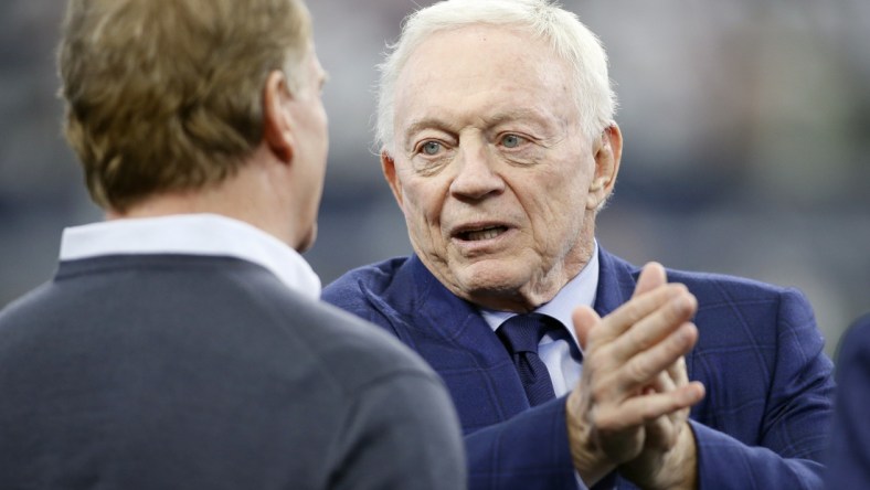 Jan 16, 2022; Arlington, Texas, USA; Dallas Cowboys owner Jerry Jones talks (R) with NFL Commissioner Roger Goodell (L) before the game against the San Francisco 49ers in a NFC Wild Card playoff football game at AT&T Stadium. Mandatory Credit: Tim Heitman-USA TODAY Sports